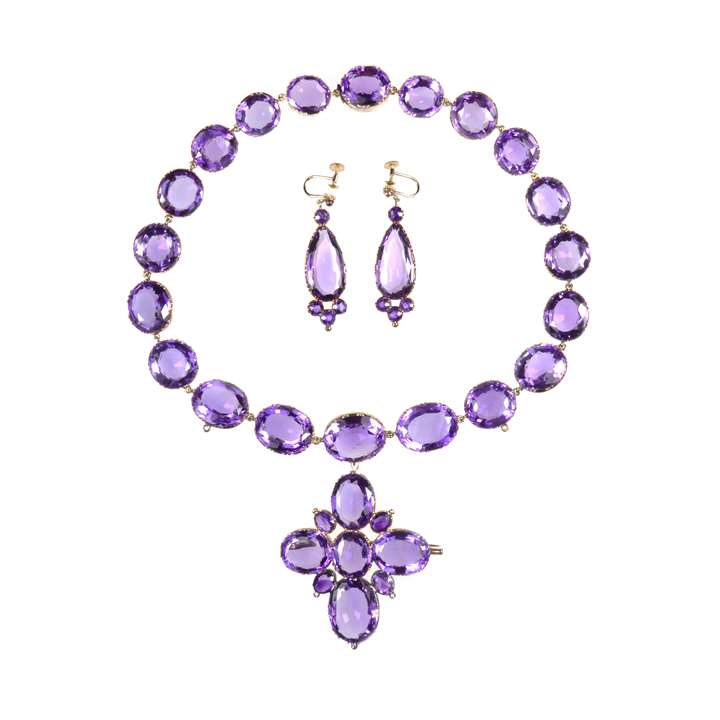 Amethyst collet cross pendant necklace and earrings en suite